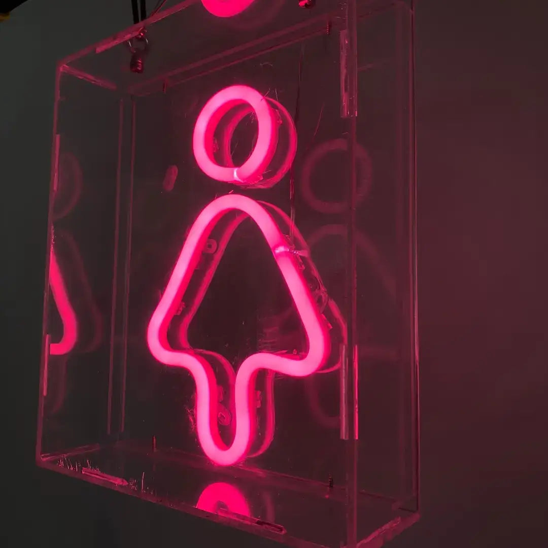 Pink neon sign with female bathroom symbol showcasing flexible neon and pre-soldered ends