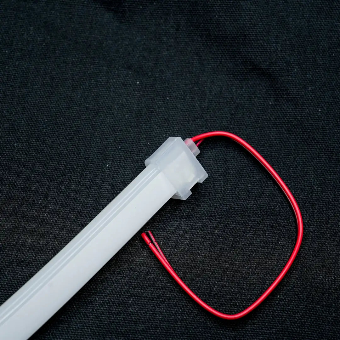 White plastic tube with red wire attached for 8x16 quick connector, effortlessly linking flexible neon