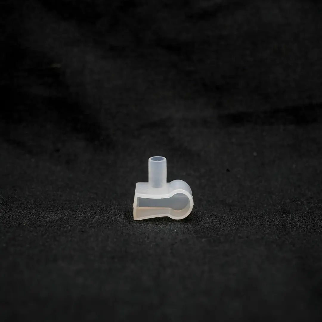 Clear plastic medical tubing connector with L-shaped bend for 10x13x22 landscape series exit end cap