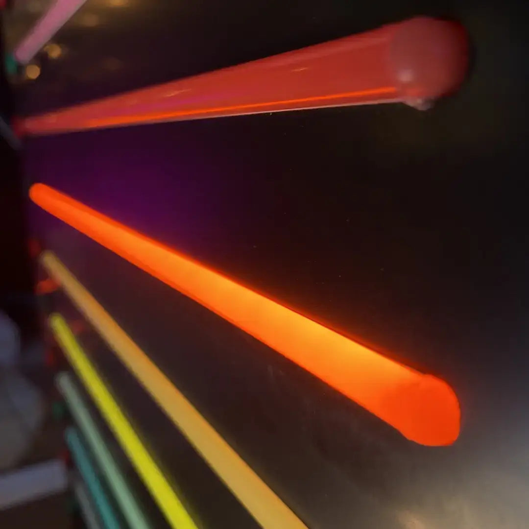 Glowing neon tubes in a fan pattern with coloured end caps for 8x16 flex neon installation
