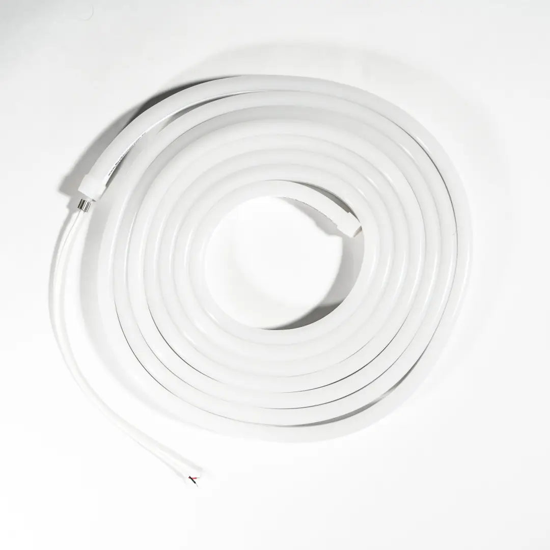 White coiled flexible neon pixel strip forming a spiral shape for architectural strips