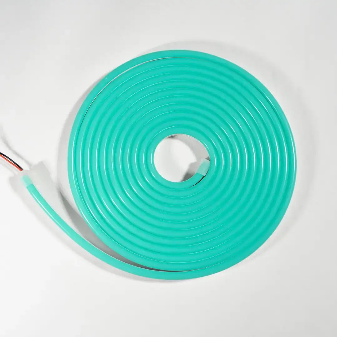 Coiled turquoise flexible neon LED strip with wiring for architectural lighting and neon led strip applications