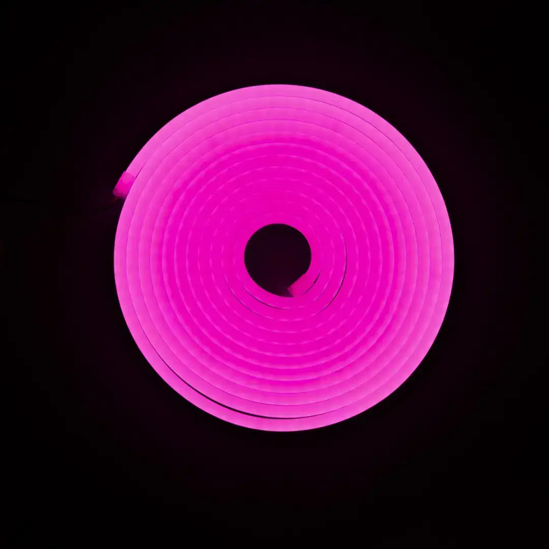 Coiled pink flexible neon light tube forming a circular shape for architectural strips