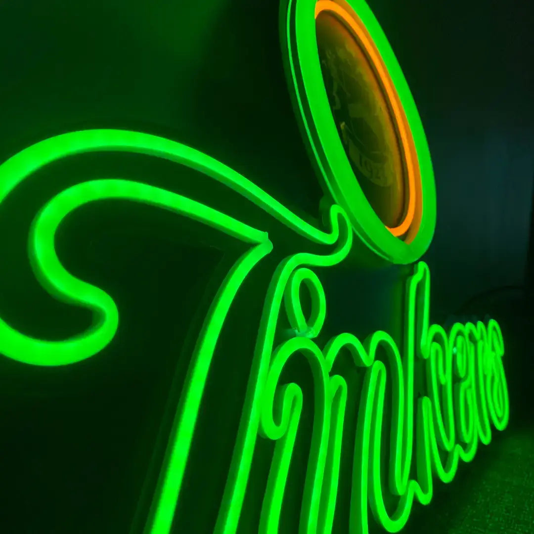 Bright green neon sign with cursive lettering showcasing flexible neon architectural strips