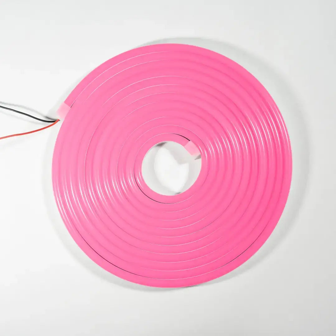 Pink neon flex LED strip coiled into a circular shape for flexible neon signs and architectural strips