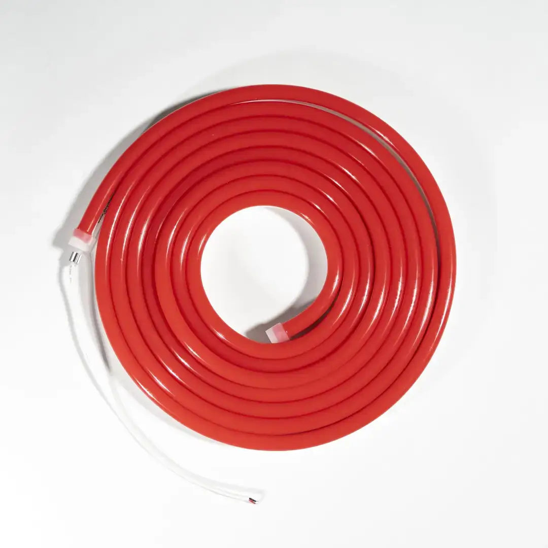 Red coiled flexible neon rubber hose arranged in a spiral, ideal for neon LED strip projects