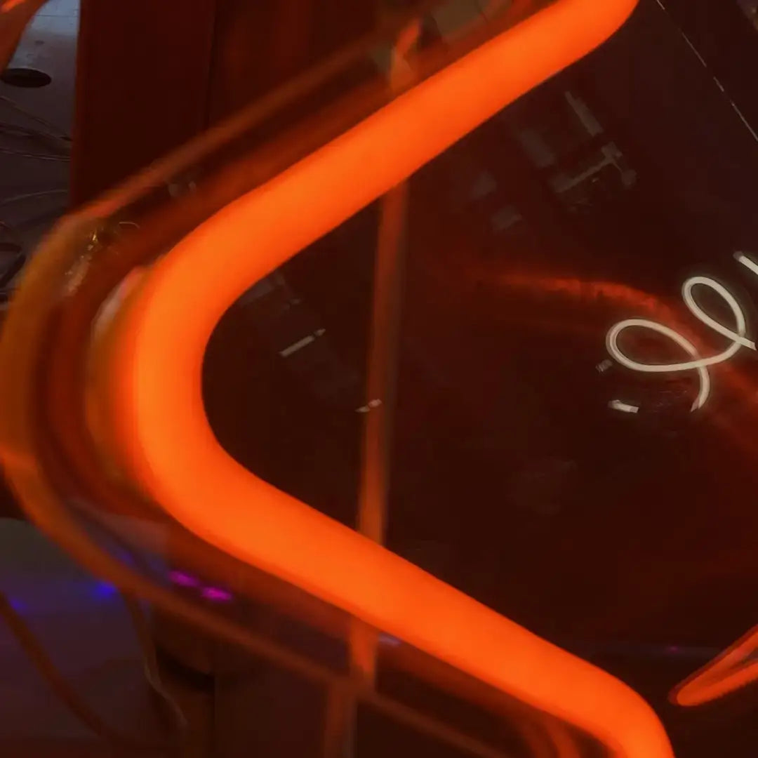 Flexible neon LED strip with curved orange neon light tube in S-shape for vibrant decor