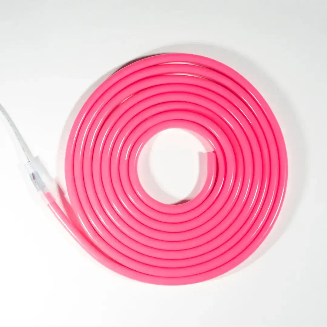 Pink coiled flexible neon led cable arranged in a spiral pattern for neon led strip lighting