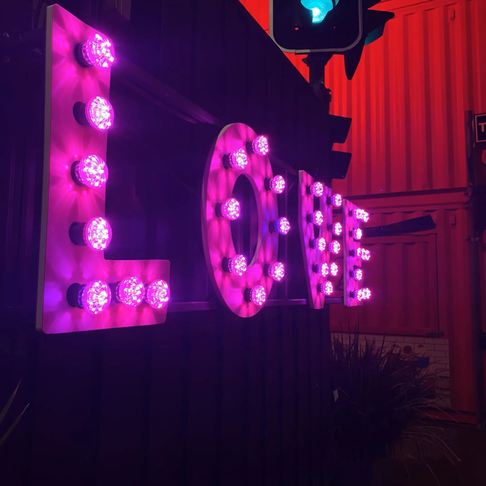 Spelling Out Style with Light: The Pink LOVE Sign
