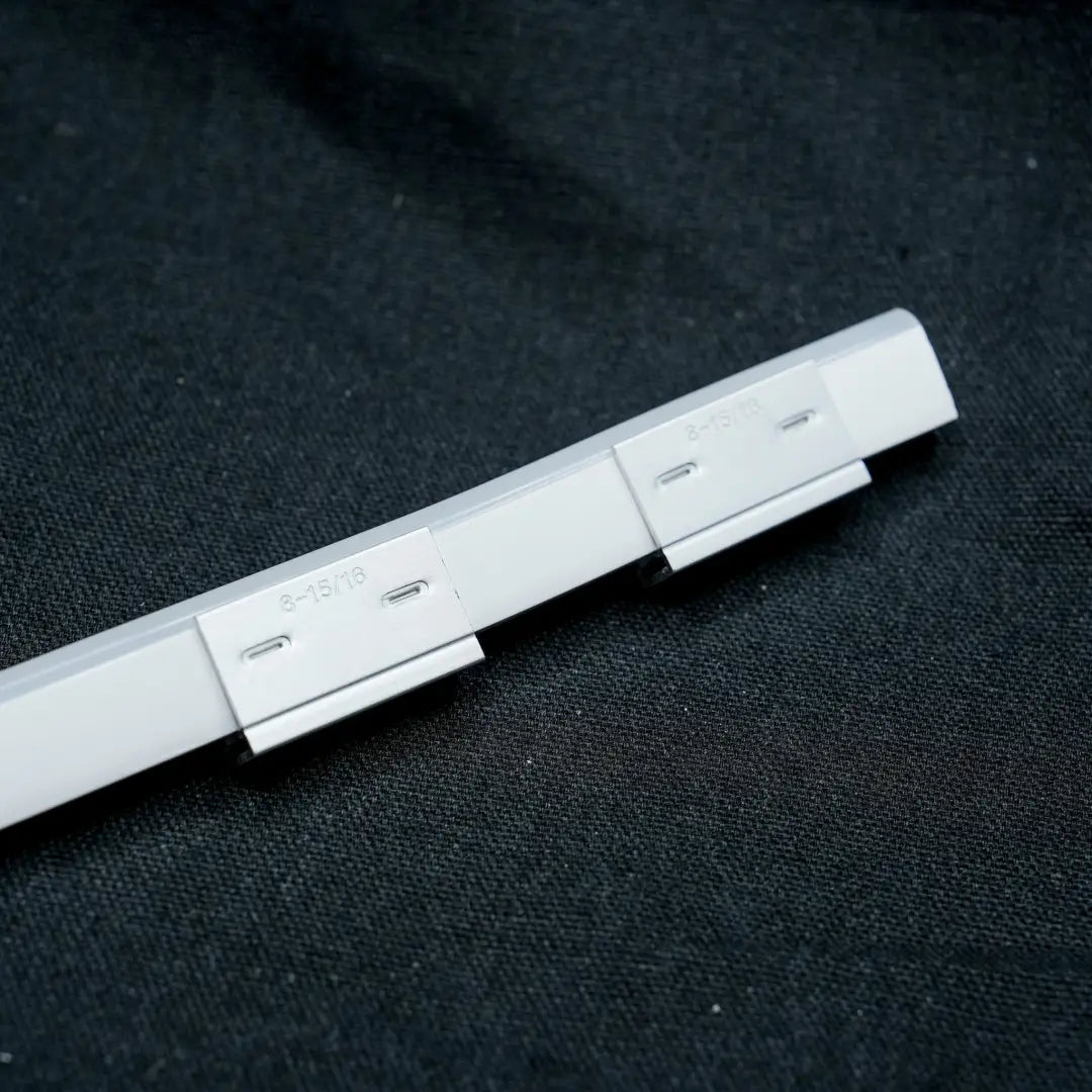 White plastic mounting bracket with multiple slots for 6x12 aluminium mount or 6x12 flex neon