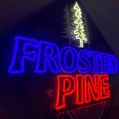 Neon sign displaying FROSTED PINE with illuminated pine tree design in 6x12 Flex Neon Royal Blue