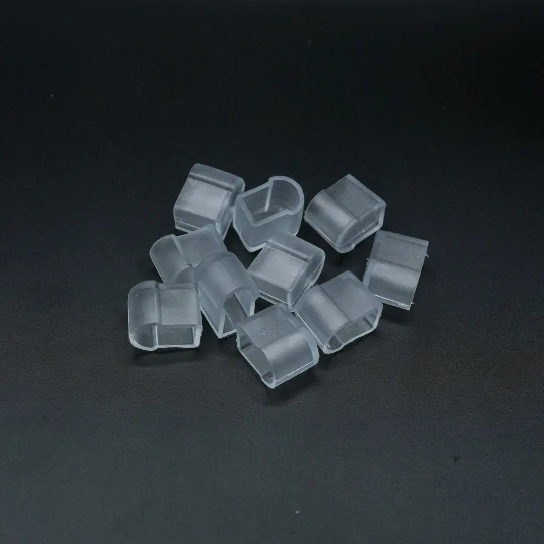 Clear plastic cube-shaped 8x10x16 end caps scattered, ideal for neon lighting setup