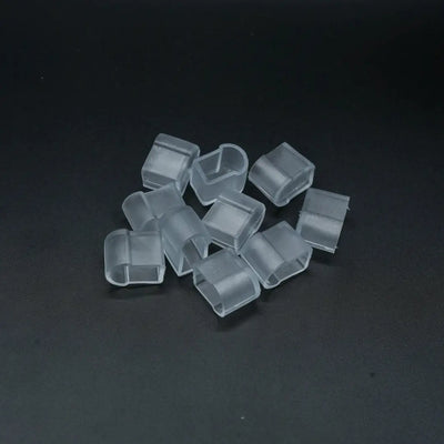 Clear plastic cube-shaped 8x10x16 end caps scattered, ideal for neon lighting setup
