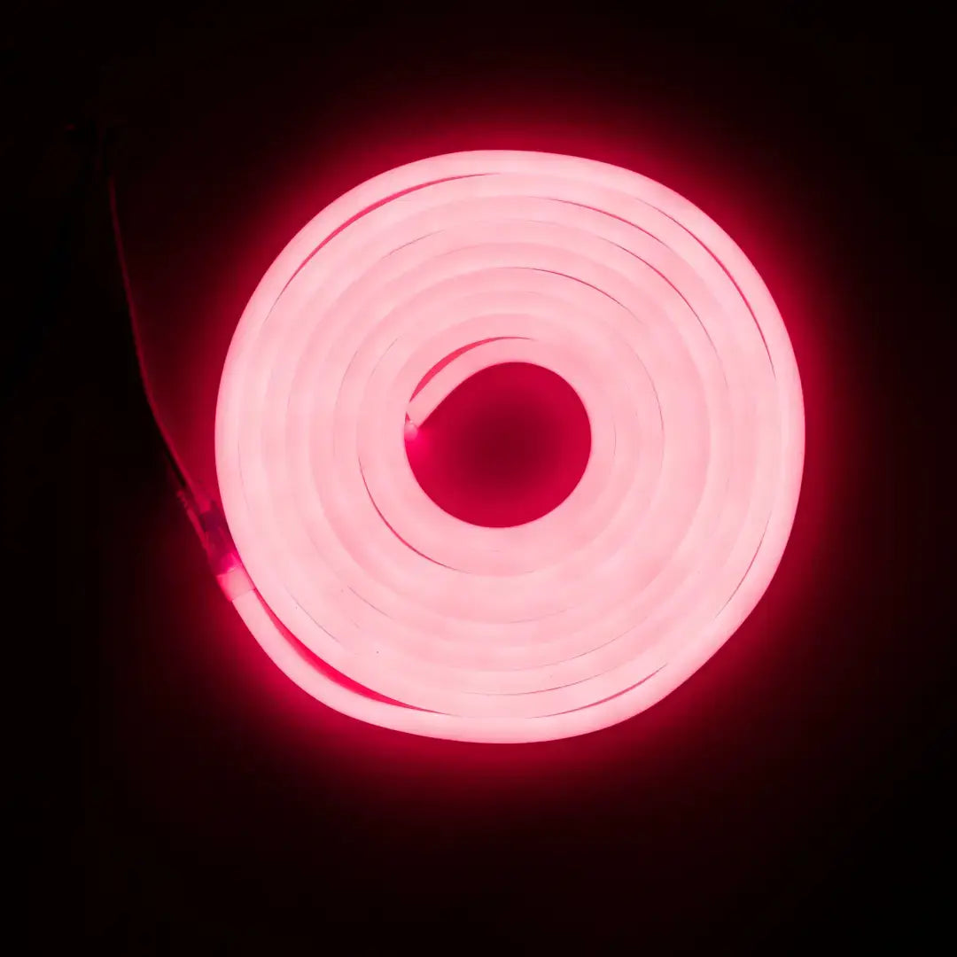 Glowing pink neon circle with concentric spiral rings showcasing flexible neon LED strip with pre-soldered ends