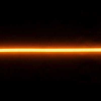 Glowing orange flex neon light streak for architectural applications and product lighting