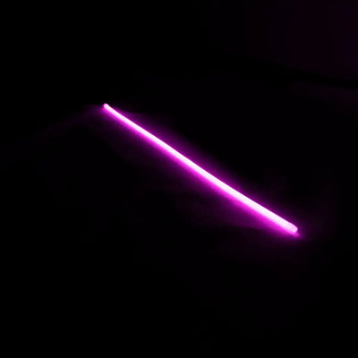 Glowing pink neon bar showcasing flex neon architectural neon product lighting against darkness