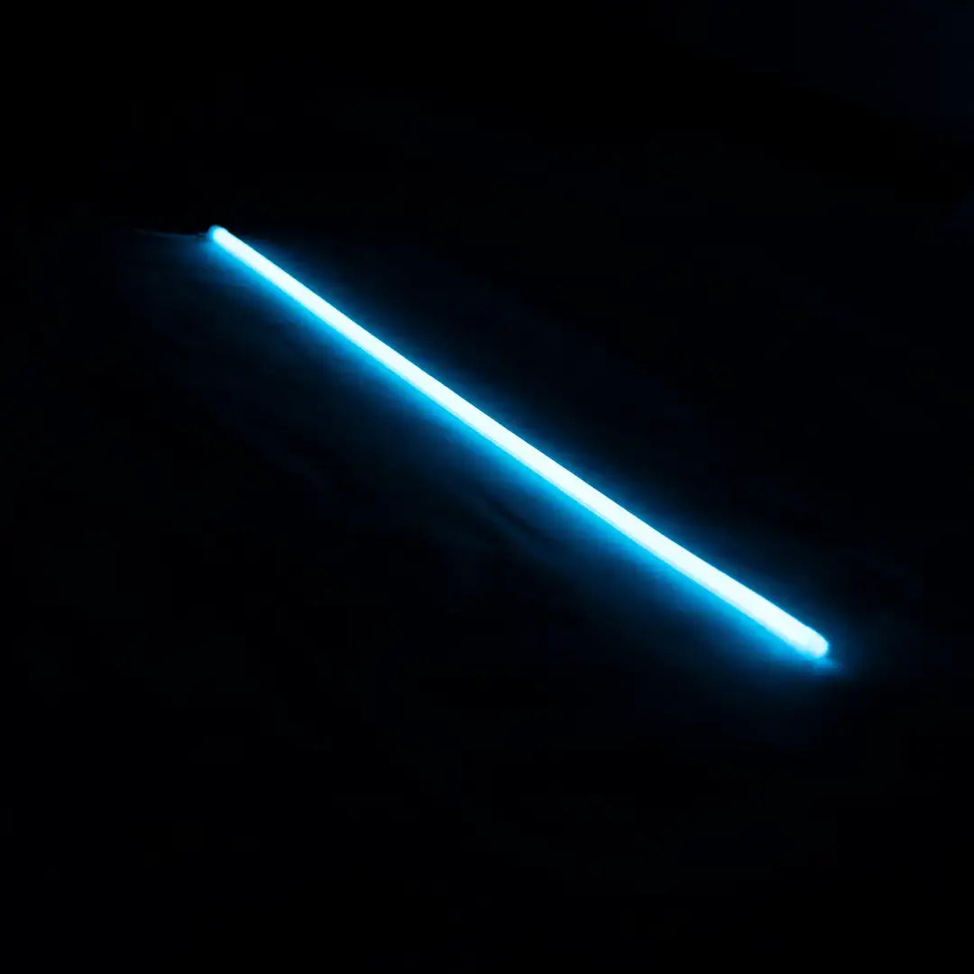 Glowing blue Flex Neon light beam against darkness for architectural neon and vertical bending