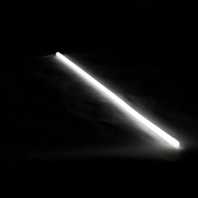 Glowing white flex neon strip for architectural lighting with vertical bending against dark background