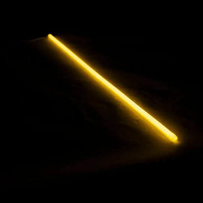 Glowing yellow neon tube showing flex neon for architectural applications with vertical bending