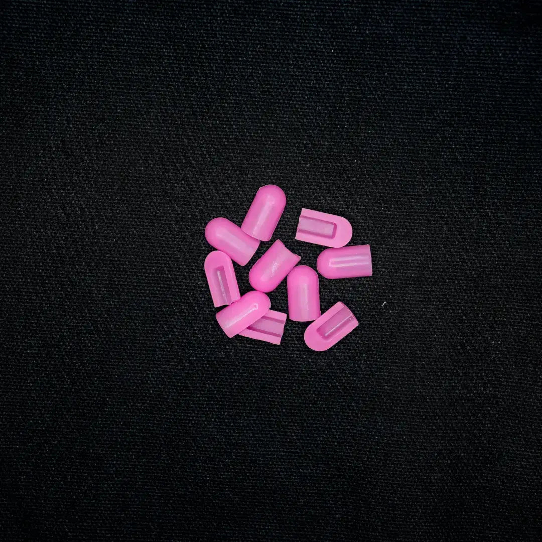 Pink pills scattered in a cluster, featuring striking hot pink coloured end caps for 6x12 flex neon displays