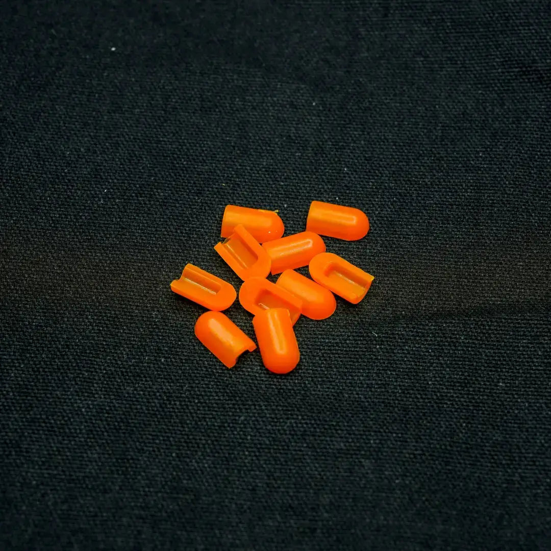 Bright orange capsule pills representing coloured end caps with tangerine orange accents for 6x12 flex neon