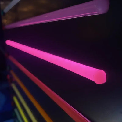 Glowing pink neon light tubes with coloured end caps for 8x16 flex neon installation