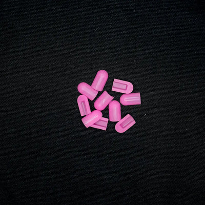 Pink pills or capsules scattered in a cluster for 8x16 End Caps Hot Pink product image