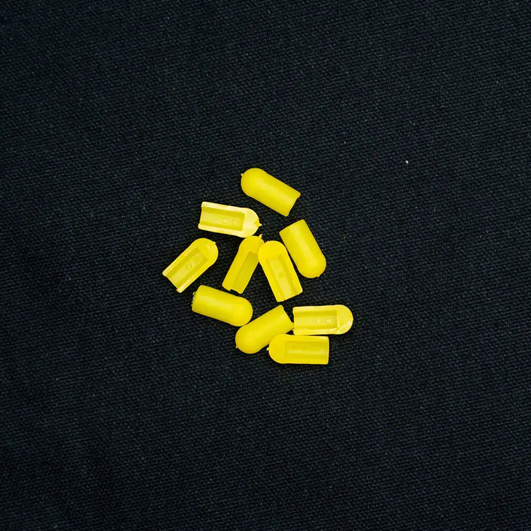 Yellow medicinal capsules scattered, perfect for coloured end caps and 8x16 flex neon installation