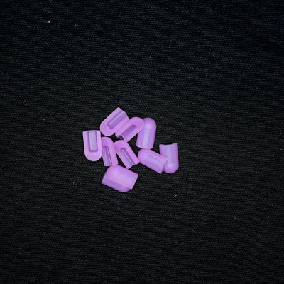 Purple plastic coloured end caps for 8x16 flex neon installation, scattered together