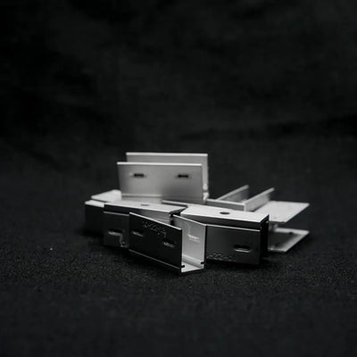 Metal staples on surface for aluminium mounting clip in neon lighting setup