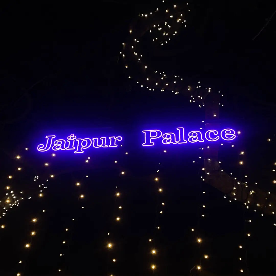 Neon blue sign Jaipur Palace with decorative lights showcasing flexible neon architectural strips