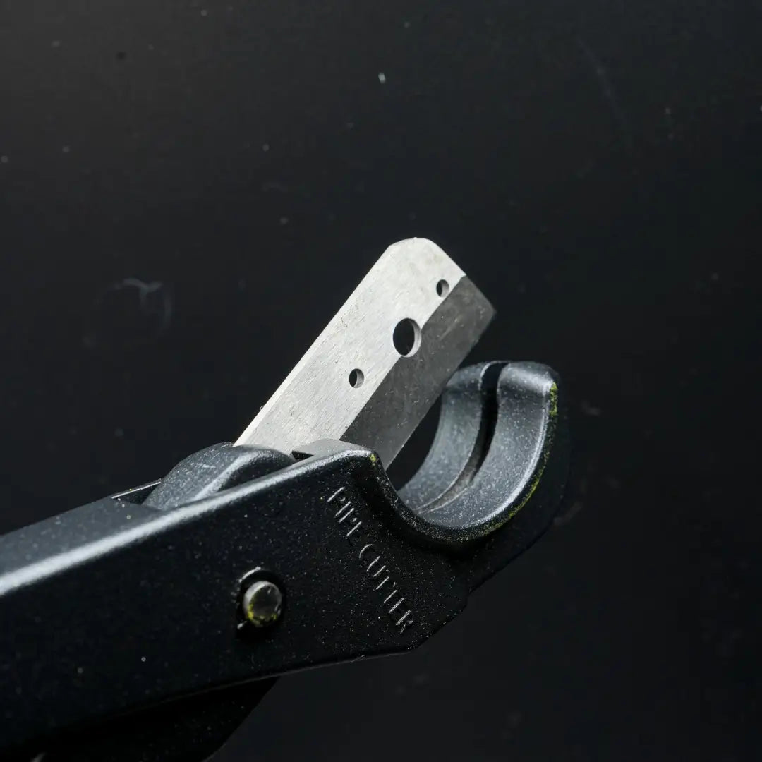 Metal hand-operated hole punch with flexible neon cutters and premium Teflon blade