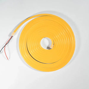 Yellow neon LED strip light coiled in a circle showing flexible neon architectural strips