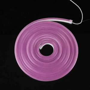 Pink neon flex tube coiled in a circular shape for flexible neon and architectural strips