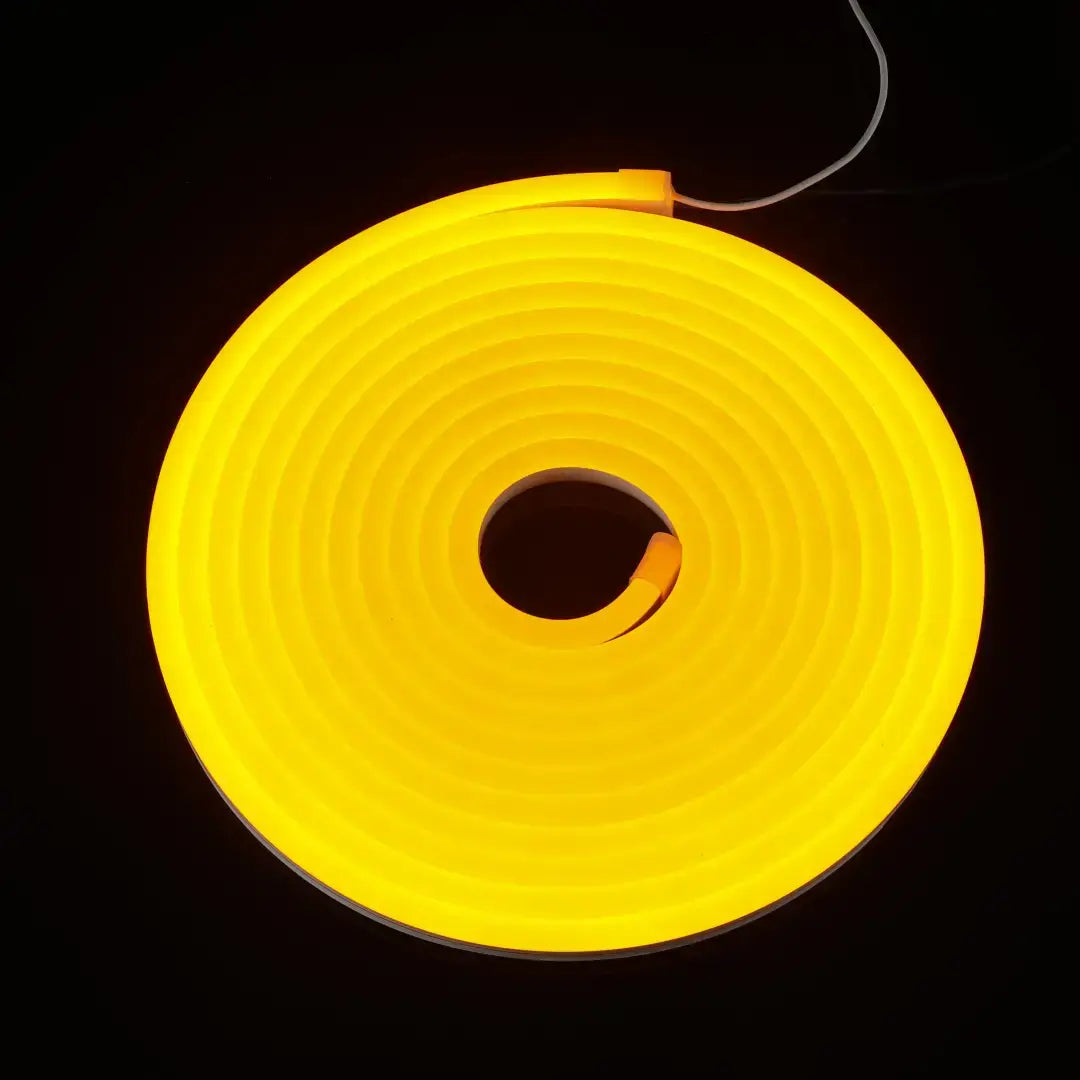 Glowing yellow neon flex tube coiled in a circle, ideal for flexible neon and architectural strips