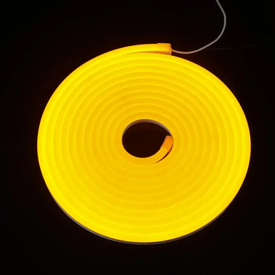Glowing yellow neon flex tube coiled in a circle, ideal for flexible neon and architectural strips