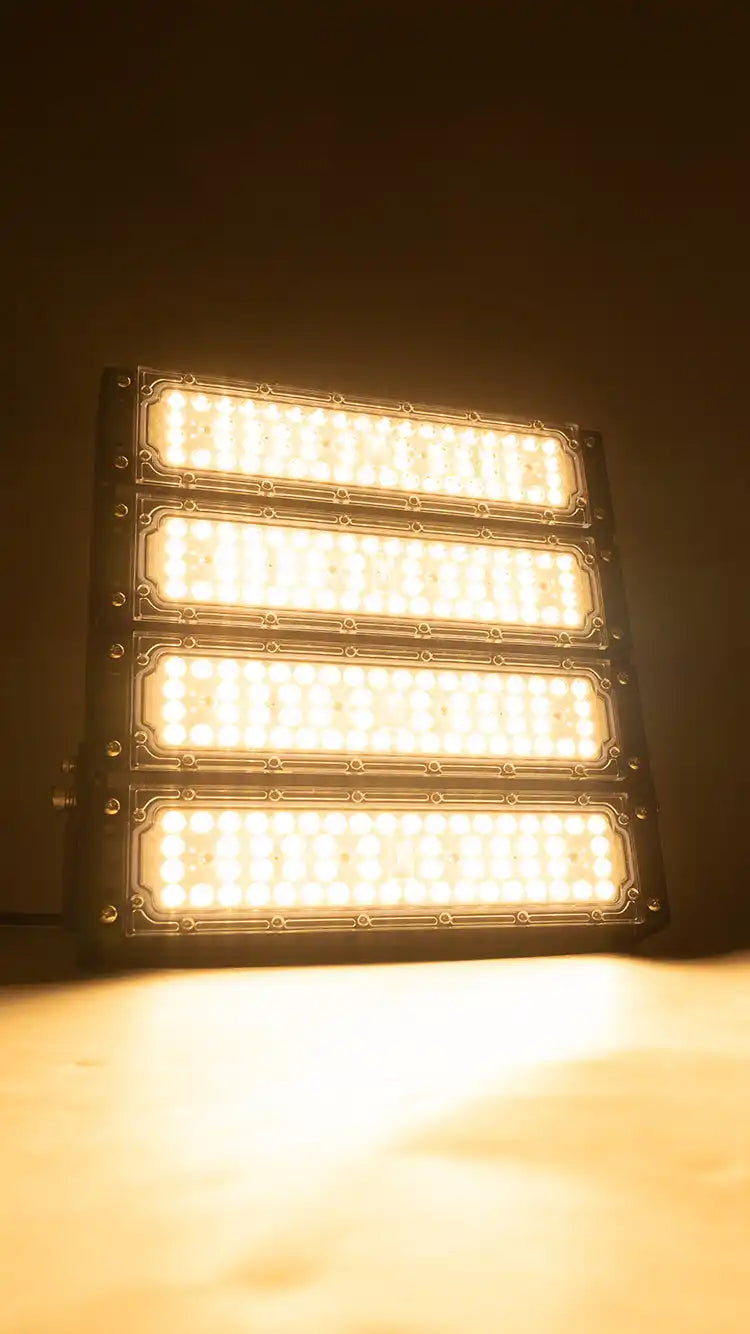 Four stacked LED light bars emitting warm white illumination.