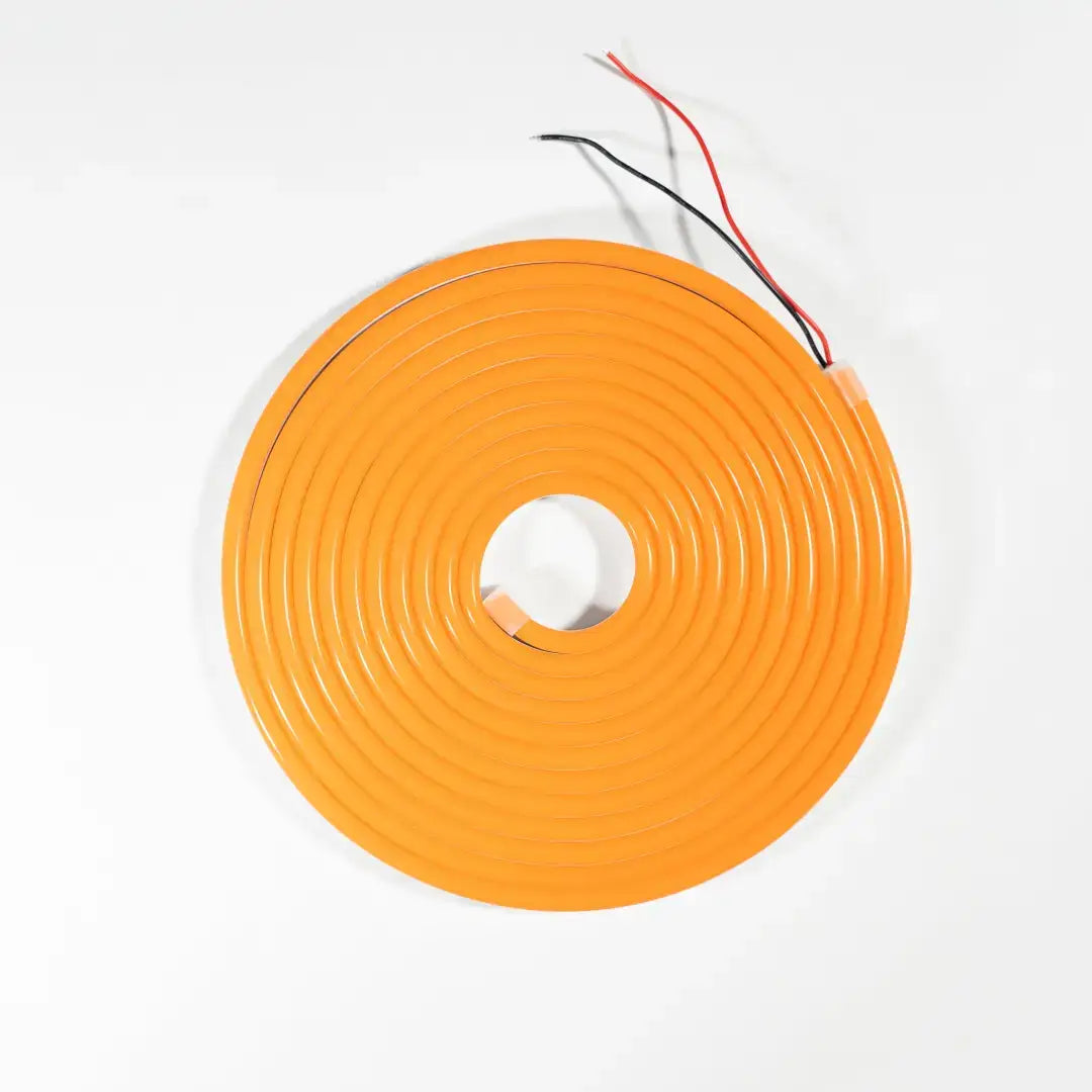Flexible neon circular LED strip in Tangerine Orange with black and red wires for architectural strips