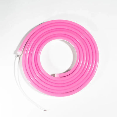 Flexible neon pink flex neon tube coiled in a circular shape for architectural strips
