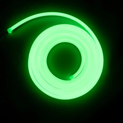 Glowing green neon flex tube coiled in a circle for flexible neon architectural strips