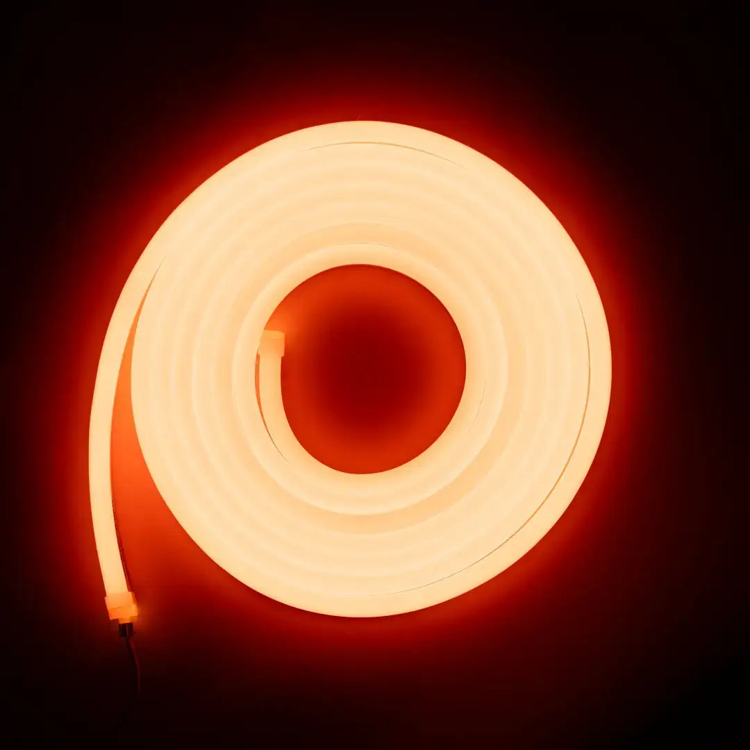 Flexible neon tangerine orange spiral tube emitting orange-red light for architectural strips