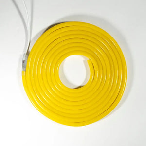 Yellow neon flex rope light coiled in a circular shape, ideal as a neon led strip for 8x10x16 pvc flex applications