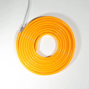 Coiled yellow neon flex tube with white connector for flexible neon LED strip lighting