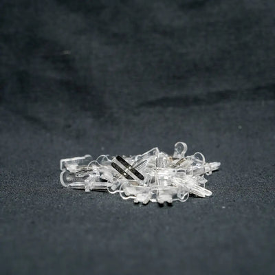 Clear plastic hair clips scattered together featuring 10x13x22 snap connectors for versatile styling