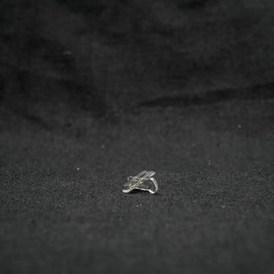 Silver ring resting on surface with 10x13x22 snap connectors in landscape series flexible design