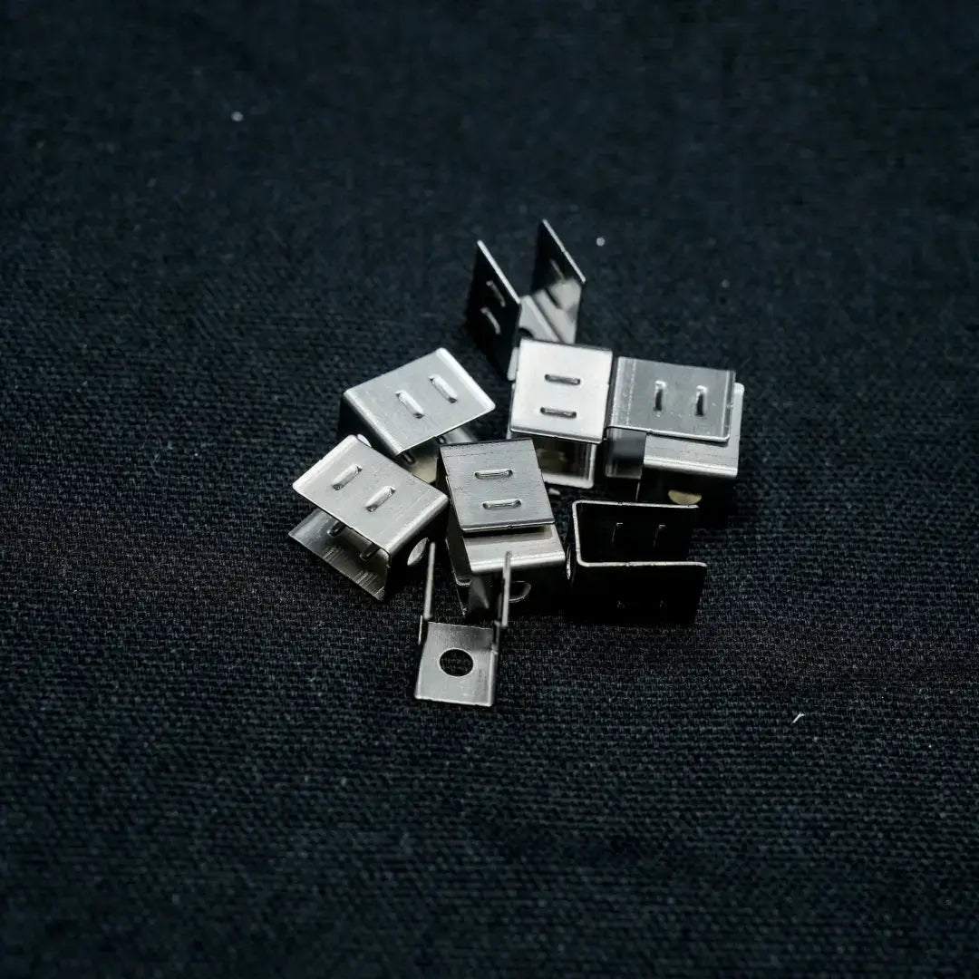 Metal USB Type-A connectors scattered with 8x16 stainless steel mounting clip product shot
